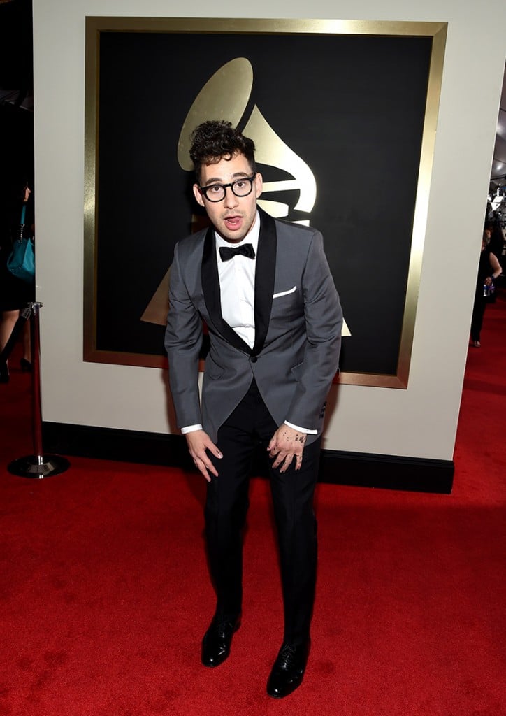 Jack Antonoff posing in a grewy jacket and black pants at the 2016 Grammy Awards