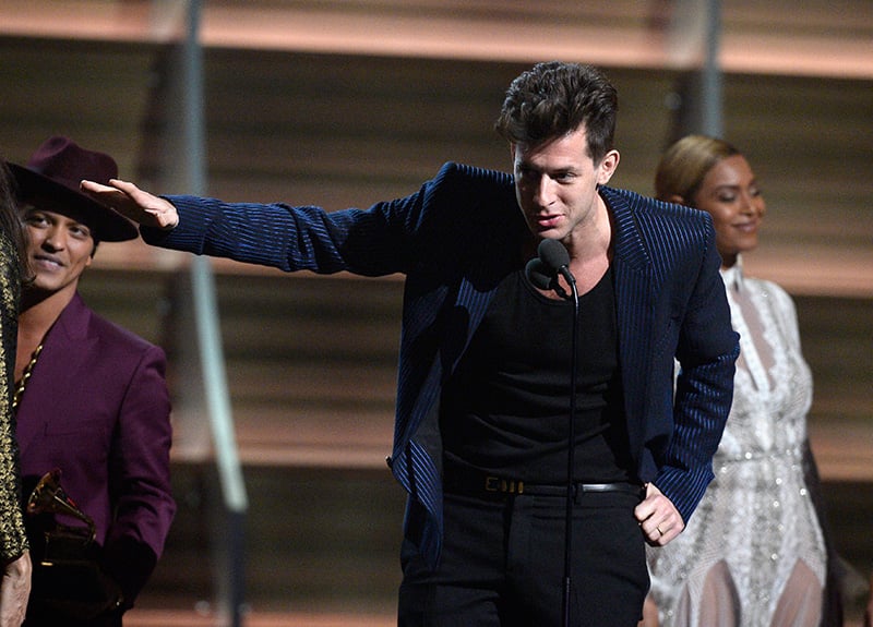 Mark Ronson onstage at the 2016 Grammy awards wearing a blue and black striped suit