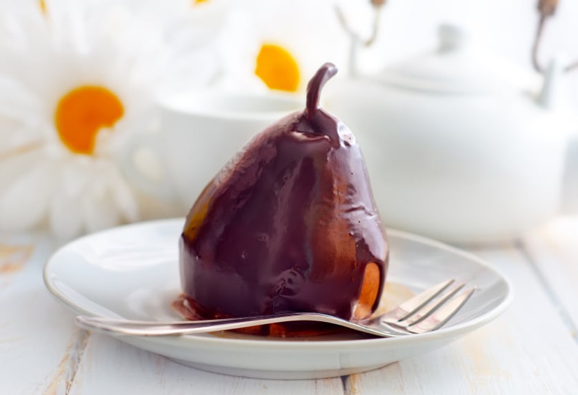 plate with a chocolate-covered pear