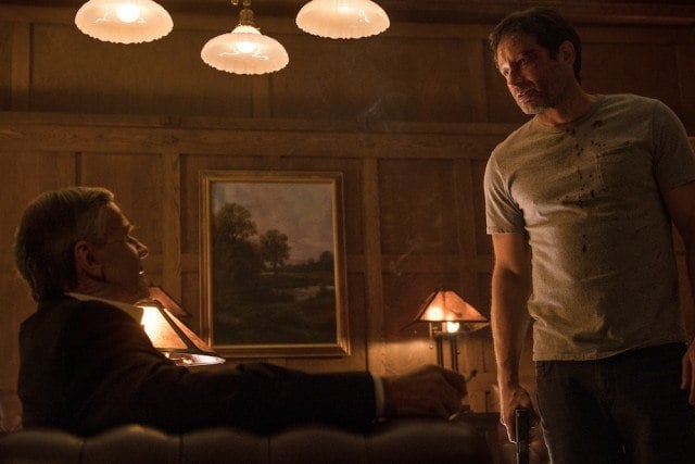 Smoking Man (William B. Davis) and Mulder (David Duchovny) have a tense confrontation in "My Struggle II"