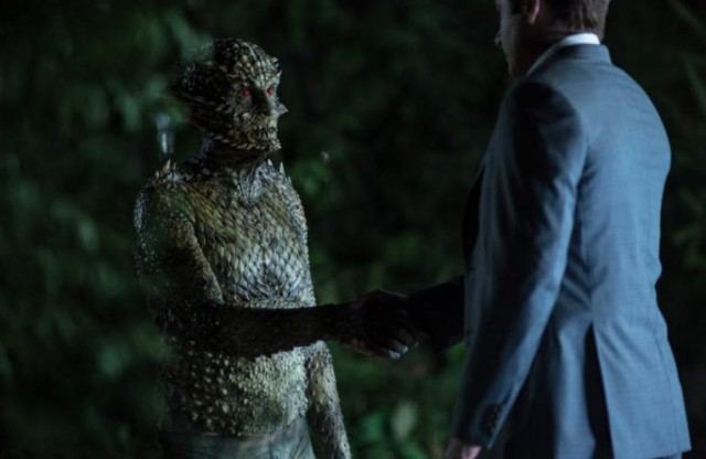 Fox Mulder (David Duchovny) shakes hand with the Were-Monster in 'The X-Files'