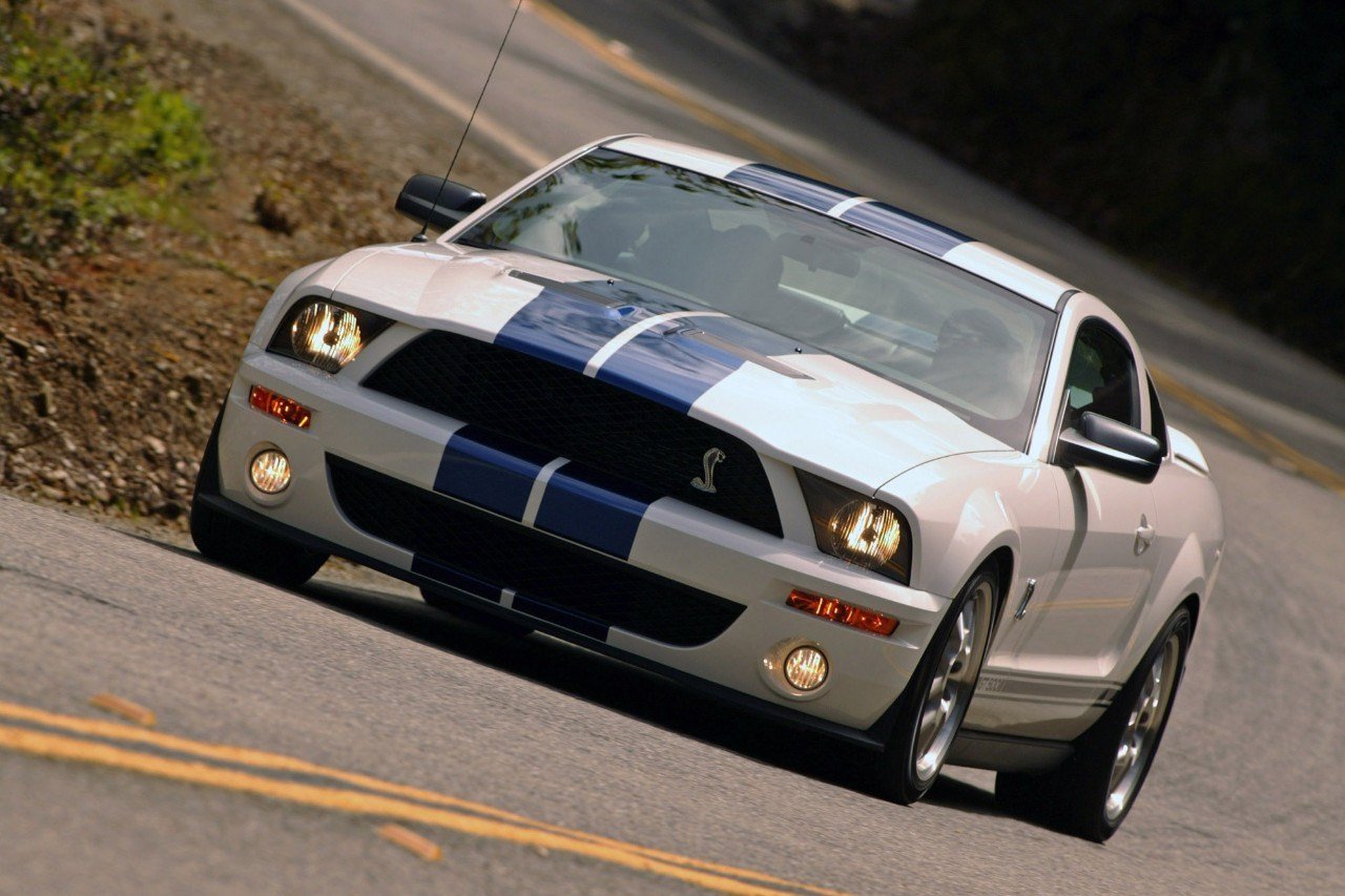 View of 2007 Shelby GT500 in white with blue racing stripes