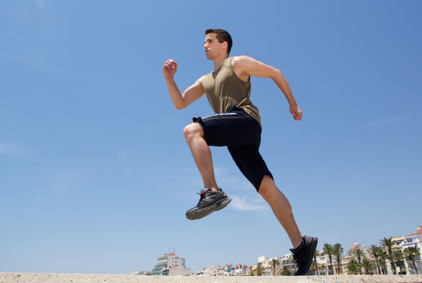 athlete warms up for exercise with high-knee skips