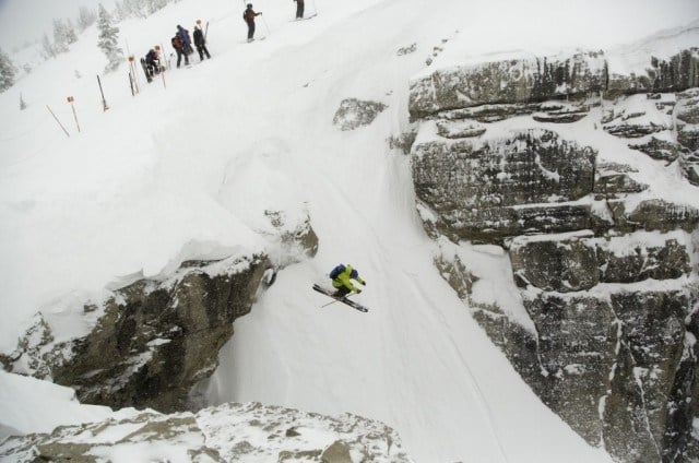 skier jumping off cliff