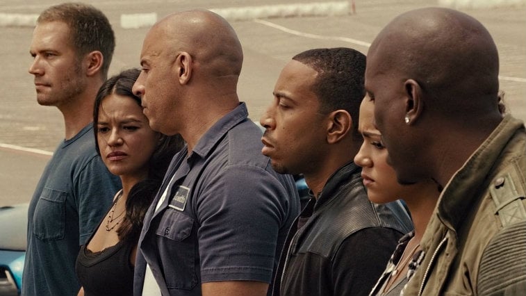 The cast of Furious 7 stands in line looking somber