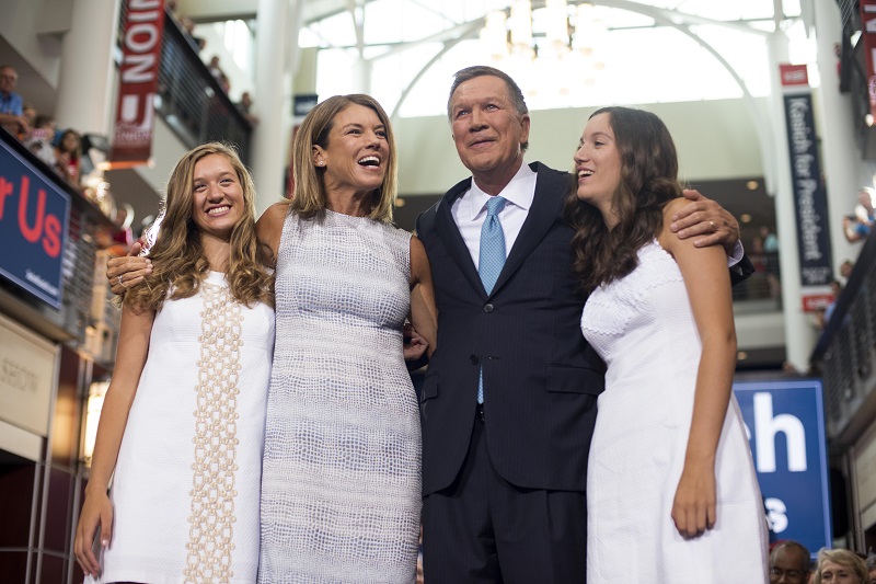 Ohio Governor John Kasich stands with his wife Karen (left center) and his daughters Emma (Blonde hair) and Reese (brown hair) after giving his speech announcing his 2016 Presidential candidacy at the Ohio Student Union, at The Ohio State University on July 21, 2015 in Columbus, Ohio. Kasich became the 16th candidate to officially enter the race for the Republican presidential nomination