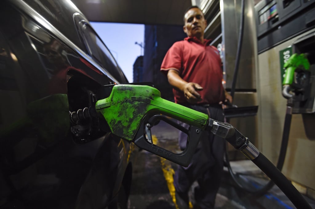A man fills his gas tank