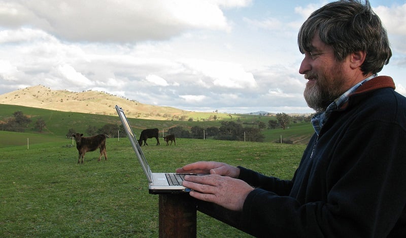 Man works remotely in a field