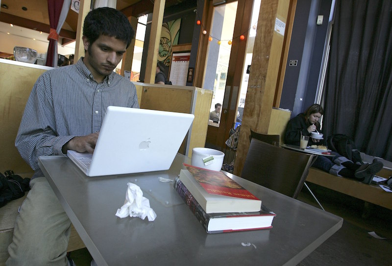 A cafe customer uses free WiFi access in San Francisco
