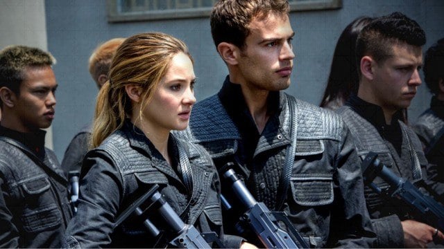 Tris (Shailene Woodley) and Four (Theo James) stand with their weapons, ready to fight in 'Divergent'