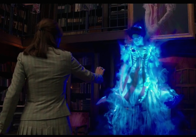 Kristen Wiig is looking at a ghost in Ghostbusters.