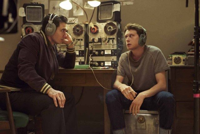 Jake (James Franco) and Bill (George MacKay) listen to recordings of Lee Harvey Oswald's conversations in a scene from 11.22.63.