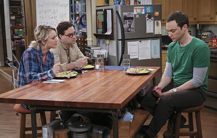 Kaley Cuoco, Jim Parsons, and Johnny Galeck eat breakfast at a table in a scene from CBS's The Big Bang Theory 