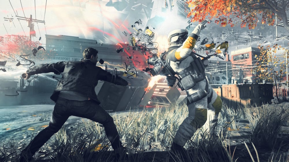 The hero of the Xbox One exclusive game Quantum Break fights against an enemy soldier. The hero of the Xbox One exclusive game Quantum Break fights against an enemy soldier.