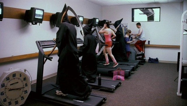 Grim reapers run on treadmills in a scene from 'Dead Like Me'