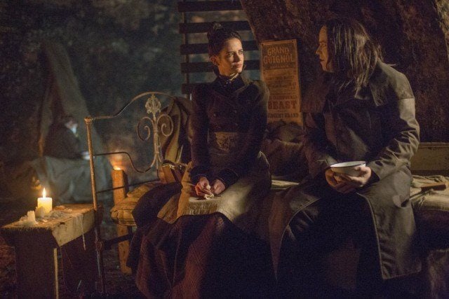 Vanessa (Eva Green) and The Creature (Rory Kinnear) sit side-by-side on a bed in 'Penny Dreadful'