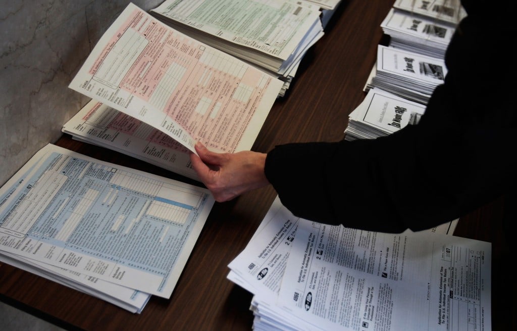 Person looking at tax forms on a table