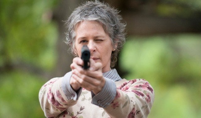 Carol (Melissa McBride) aims her gun in a scene from AMC's 'The Walking Dead'