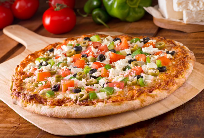 Greek Pizza on a wooden board