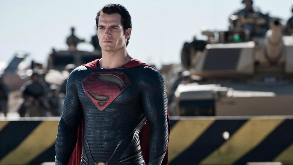 Henry Cavill wears the Superman outfit and cape in Man of Steel Henry Cavill wears the Superman outfit and cape in Man of Steel
