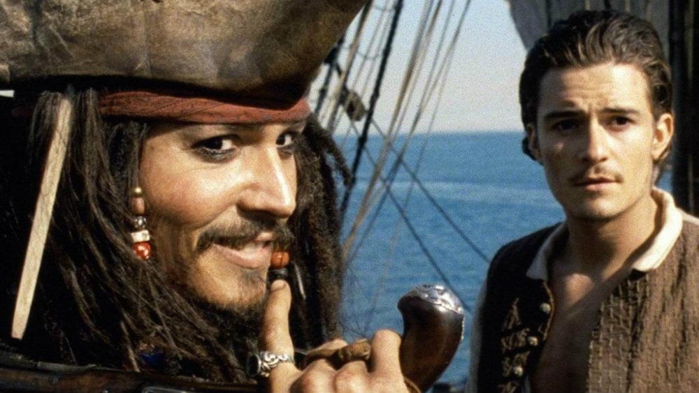 Johnny Depp and Orlando Bloom in Pirates of the Caribbean: The Curse of the Black Pearl