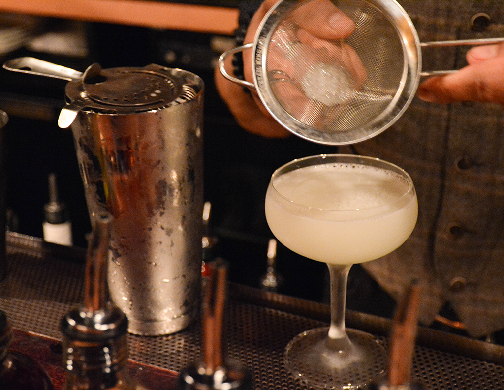 Darnell Holguin straining a daiquiri