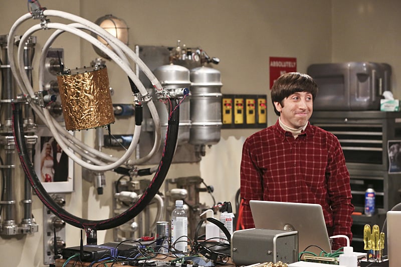 Howard Wolowitz stands in front of his project in a lab in The Big Bang Theory