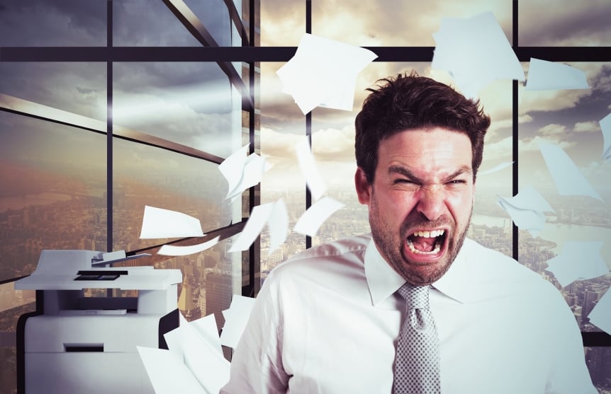 Businessman stressed and angry in office