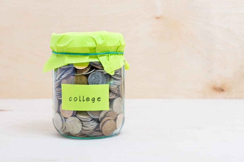 glass jar full of coins displaying college