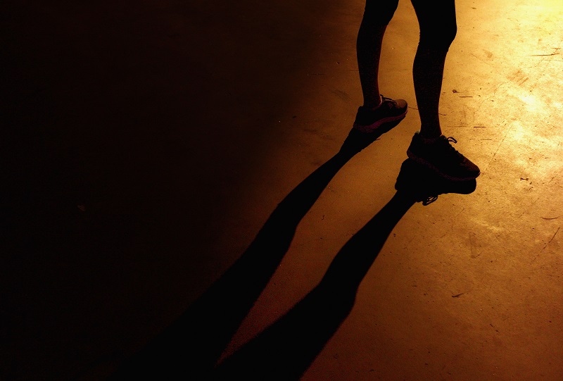 A runner waits at the start of a night race