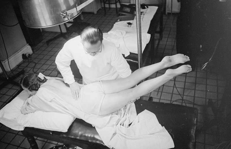 Osteopath Wilfred Smith manipulating a patient's back