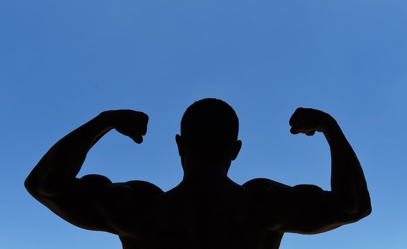 Man flexing his muscles Man flexing his muscles