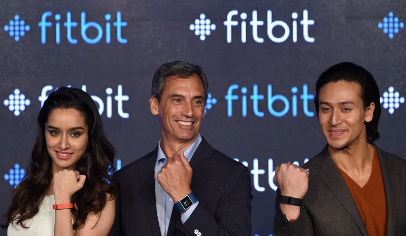 Fitbit's Chief Revenue Officer Woody Scal and Indian Bollywood actors Shraddha Kapoor (L) and Tiger Shroff