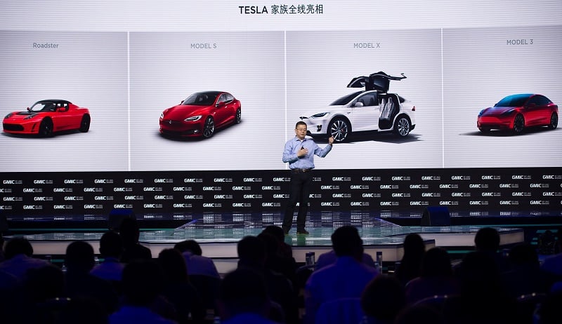 Robin Ren Global VP and Head of APAC Tesla Motors makes a speech during the Global Mobile Internet Conference (GMIC) at the National Convention Centre in Beijing on April 28, 2016. GMIC is hosting mobile executives, entrepreneurs, developers, and investors from around the world. Tesla can silence the critics.