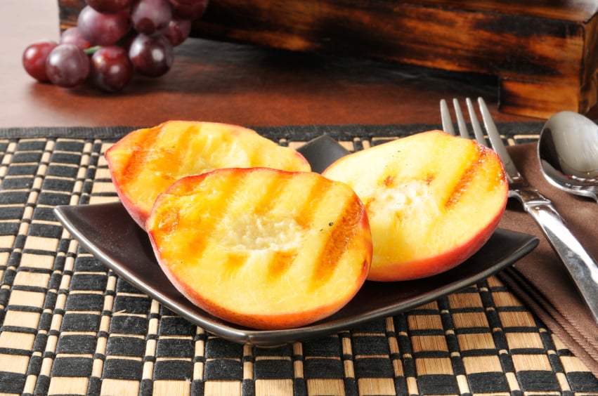 Grilled peaches with fork