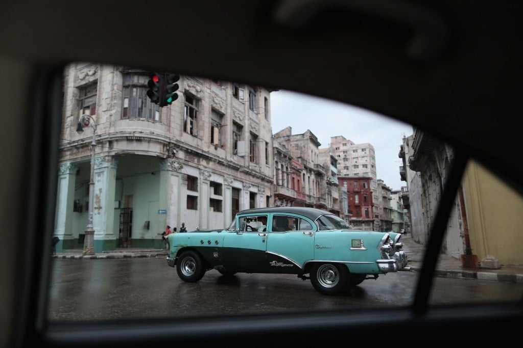 A classic American teal car is seen in Cuba's capital city of Havana