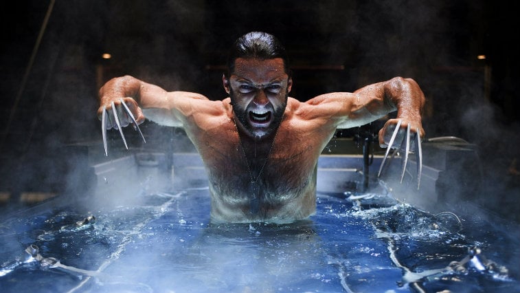 Hugh Jackman as Wolverine in a pool looking angry and bearing his claws