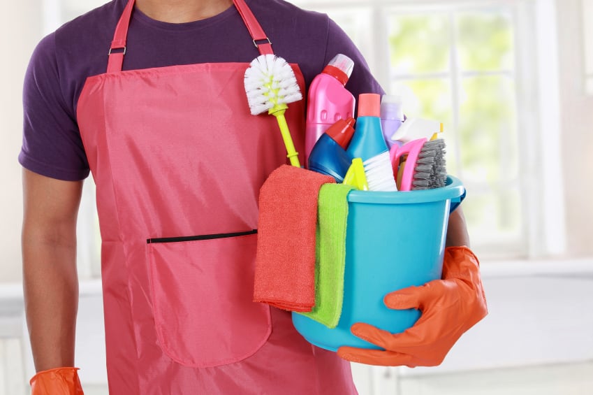 man holding cleaning products