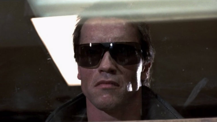 Arnold Schwarzenegger wearing sunglasses in The Terminator.