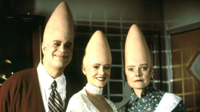Dan Aykroyd, Michelle Burke, and Jane Curtain pose next to each other in Coneheads