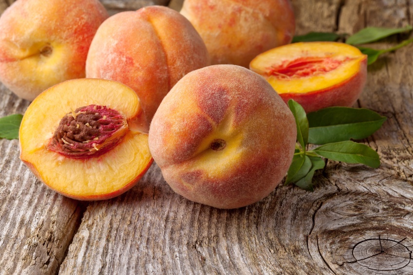 peaches on wooden background