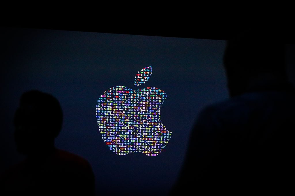 The Apple logo is displayed on a screen at Apple's annual Worldwide Developers Conference presentation at the Bill Graham Civic Auditorium in San Francisco, California, on June 13, 2016. / AFP / GABRIELLE LURIE (Photo credit should read GABRIELLE LURIE/AFP/Getty Images)