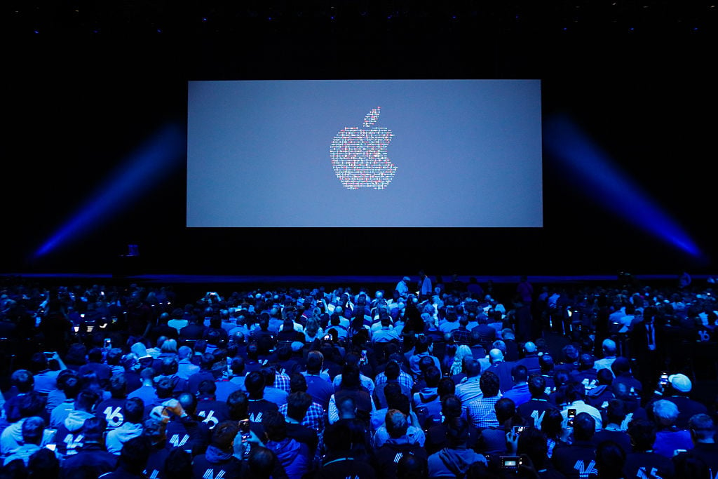 People take their seats ahead of Apple's annual Worldwide Developers Conference presentation at the Bill Graham Civic Auditorium in San Francisco, California, on June 13, 2016. / AFP / GABRIELLE LURIE (Photo credit should read GABRIELLE LURIE/AFP/Getty Images)