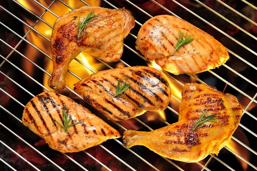 chicken pieces on a grill