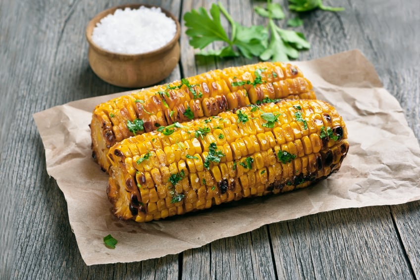 two grilled corn cobs