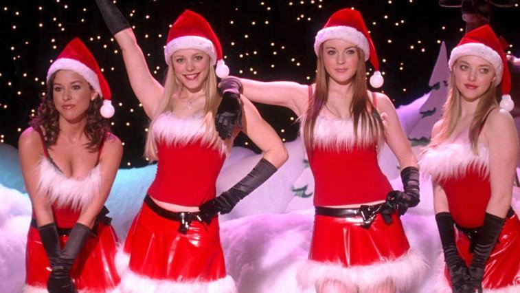The 'Mean Girls' clique stands wearing Christmas outfits during their talent show performance.