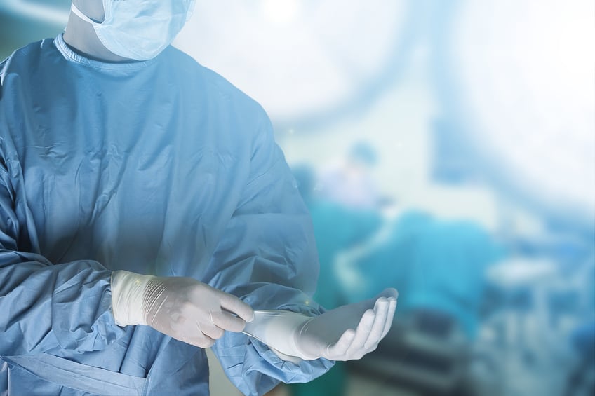 medical team suiting up prior to surgery