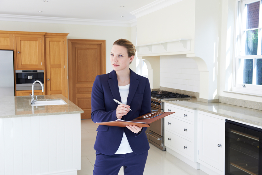Realtor Looking Around Vacant Property