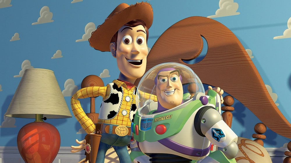 Woody puts his arm around Buzz Lightyear in Andy's room.