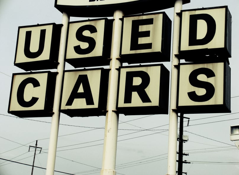 sign board saying 'used cars'
